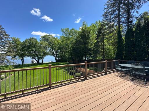 Step out onto the expansive lakeside deck with a retractable awning and take in the peaceful setting.
