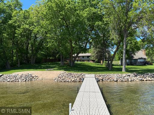 Enjoy the best of lake living with this stunning walkout home set on a spacious, tree-lined lot with level elevation to the waterâs edge.