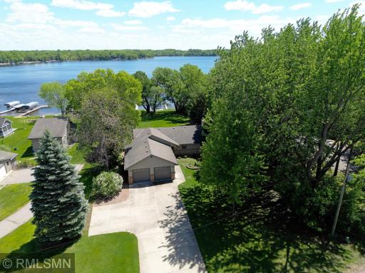 Thoughtful landscaping and natural tree coverage add a serene, park-like feel - a peaceful retreat just minutes from town amenities.