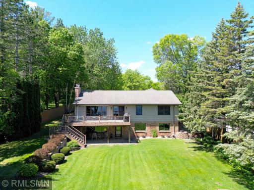 Nestled on a beautifully manicured lot surrounded by mature trees, this inviting home offers the perfect blend of privacy, space, and charm.