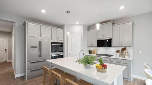 Large island is perfect for cooking and entertaining! Photo virtually staged, colors and options may vary.