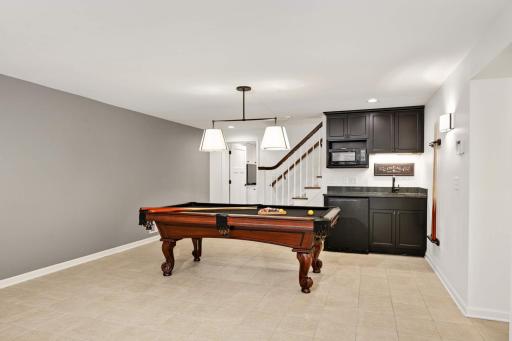 There is a wet bar, microwave and Uline beverage refrigerator