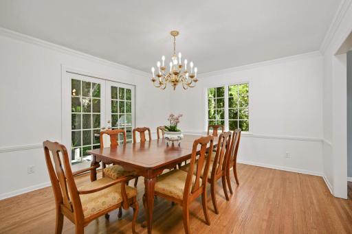 The spacious Dining room is perfect for formal entertaining and large family get-togethers and has a French door out the the backyard.