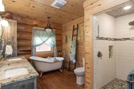 Custom Bath with tile shower, cast iron claw foot tub and granite tops