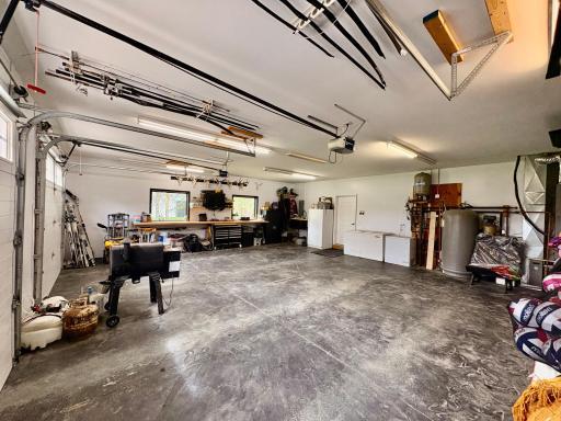 Spacious attached garage with floor drain