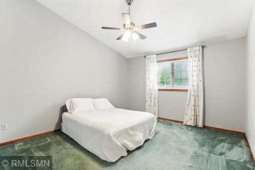 Primary bedroom with vaulted ceilings and room for a large bed set