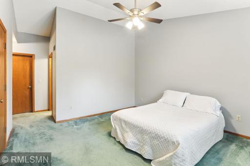 Primary bedroom with vaulted ceilings and room for a large bed set