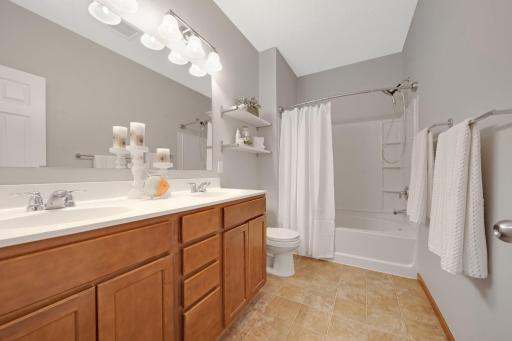 Spacious, double vanity, and beautiful surround.