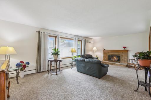 Living room has a brick wood burning fireplace for warm winter days and nights.