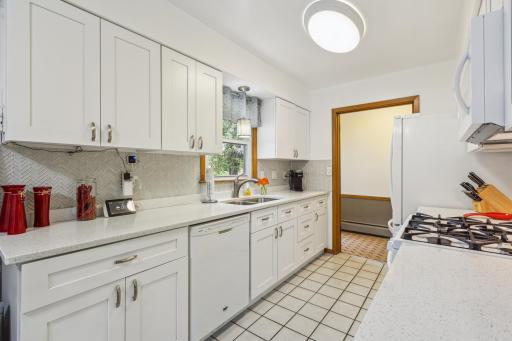 The heart of the home, a kitchen. Cooks and bakers will be thrilled to create their favorite culinary masterpieces here. Remodeled kitchen with quartz countertops, stylish glass back splash, soft close cabinets and drawers. Let's eat!