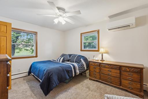 Comfortable and inviting owner's suite with 3/4-bathroom, closet and ceiling fan.