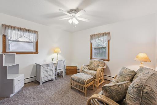 Bedroom 3 may also be used as an office, playroom, or library with ceiling fan and closet.