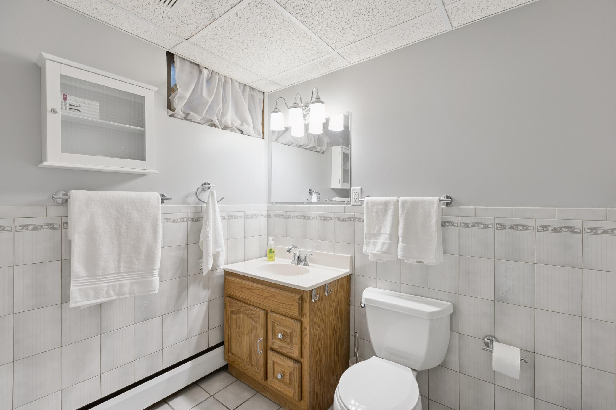 Lower-level bathroom with shower, newly painted.