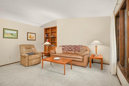 The living room includes a built in bookshelf.