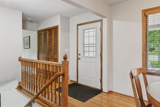 The front entry is just off the covered porch and has an adjacent coat/storage closet.