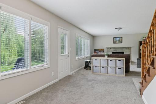 Out the door to the left you access the amazingly lush back yard. In addition the wall of windows brings in great natural light.