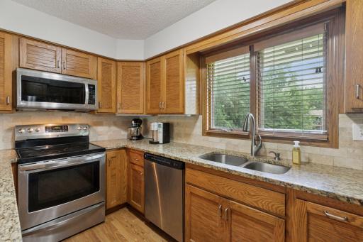 The kitchen window looks out over the incredibly lush back yard!