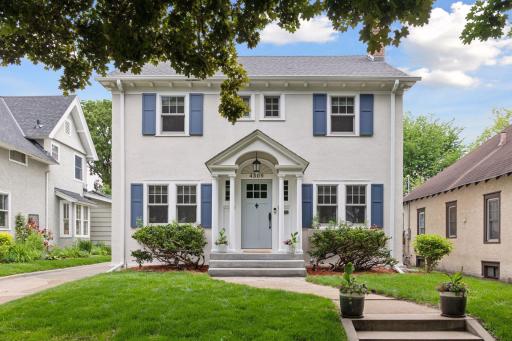 This home features a fresh exterior and eye-catching details that enhance its curb appeal.