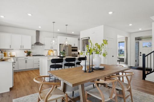 (Photo of a decorated model, actual finishes will vary) The breakfast room provides a convenient spot for casual meals and friendly conversations between the kitchen and family room.