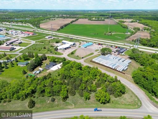 The acreage has residential housing on one side and then commercial and industrial use on the other sides.