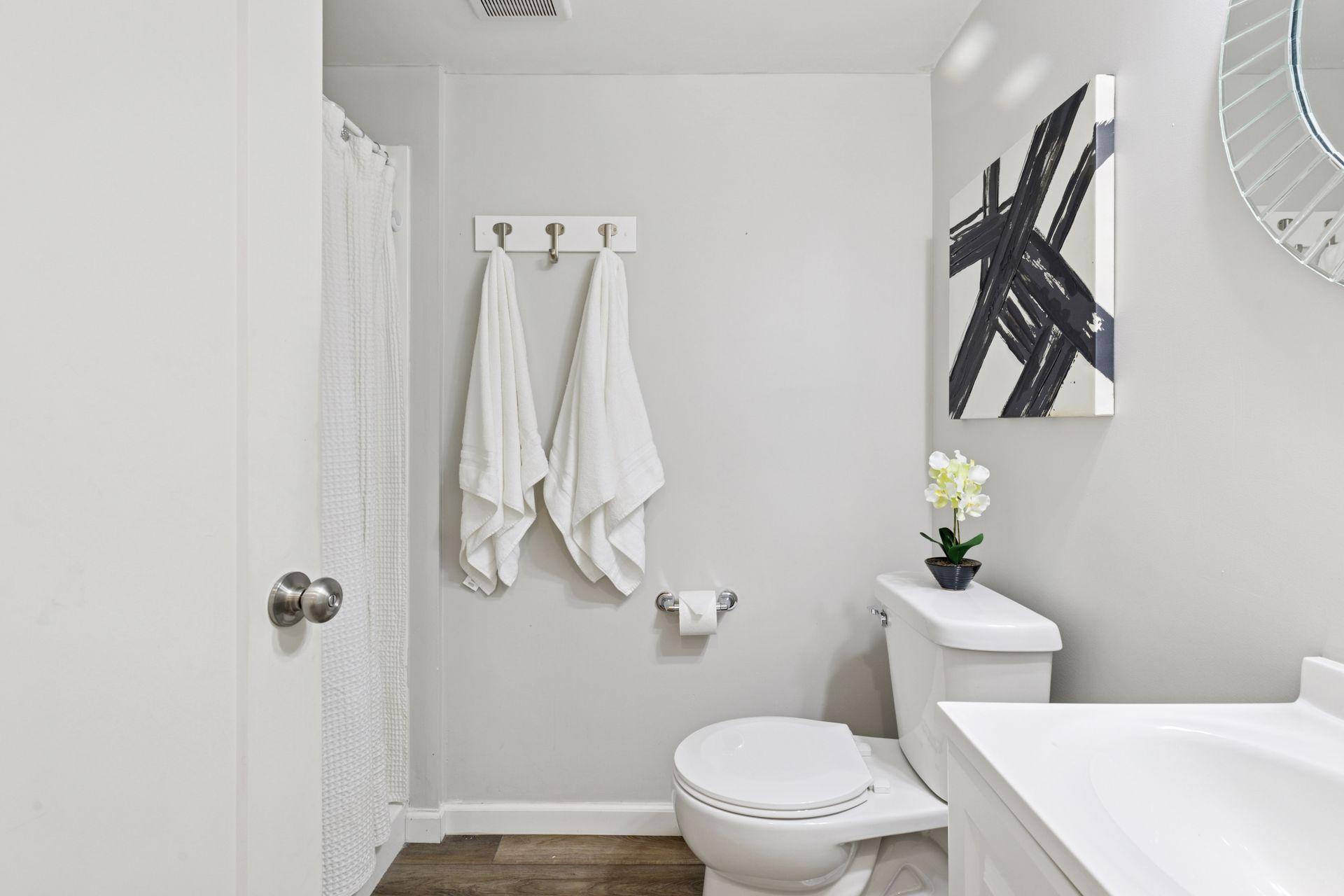 Lower level 3/4 bath features fresh paint and LVP flooring.