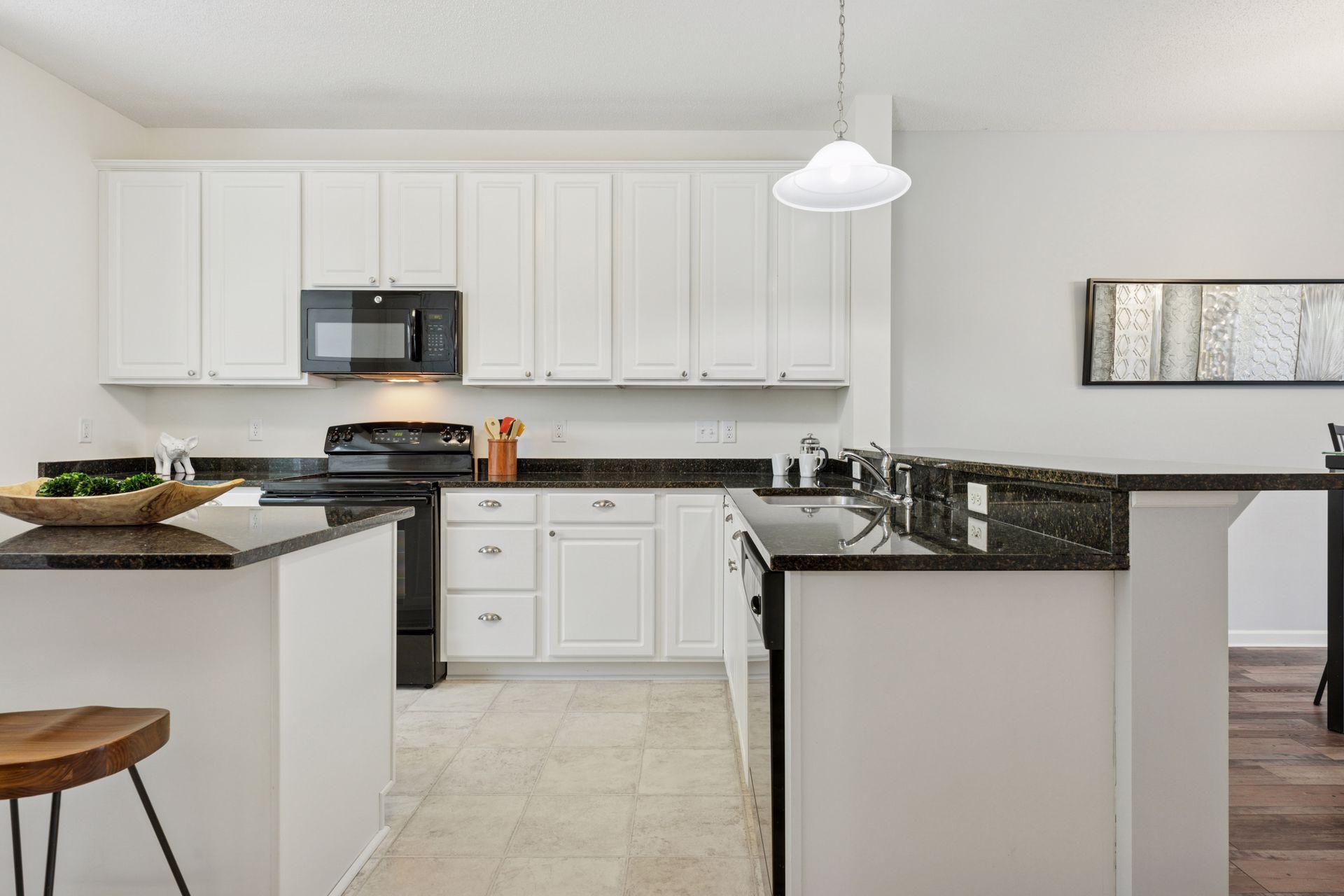 This side of the kitchen features another breakfast bar area as well.