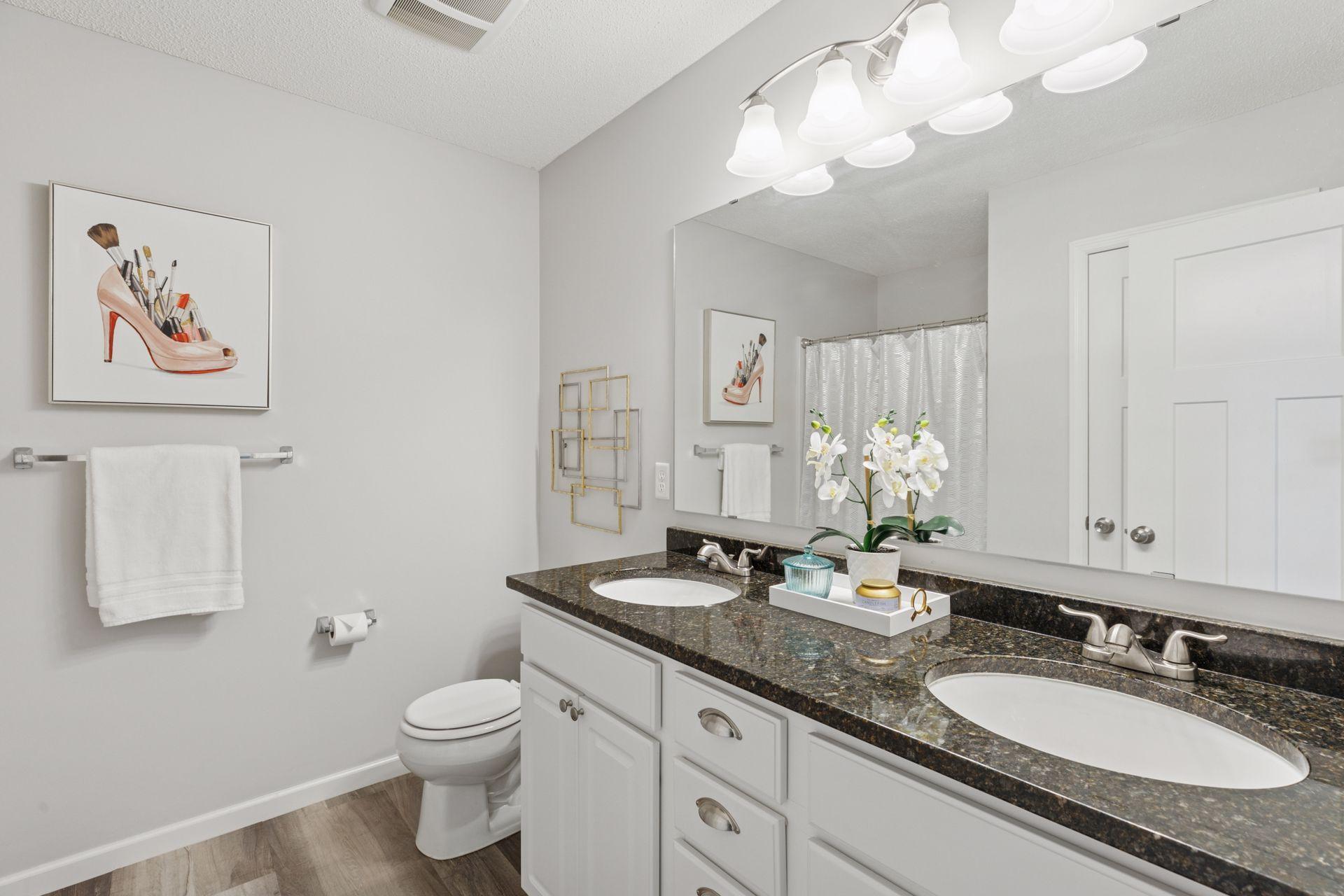 Primary bath features, new lighting, granite countertops with double sinks, walk in shower and LVP flooring!