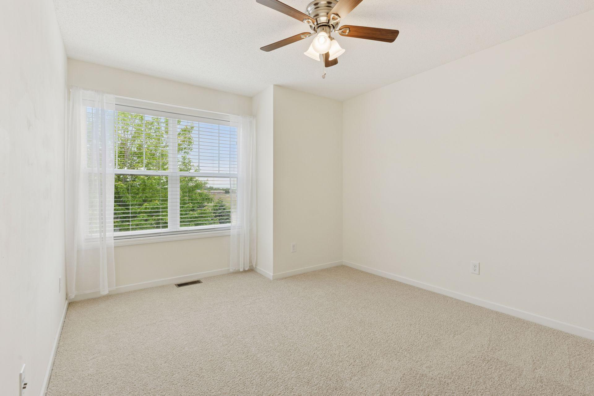 Upper level 2nd bedroom with fresh paint and carpet.