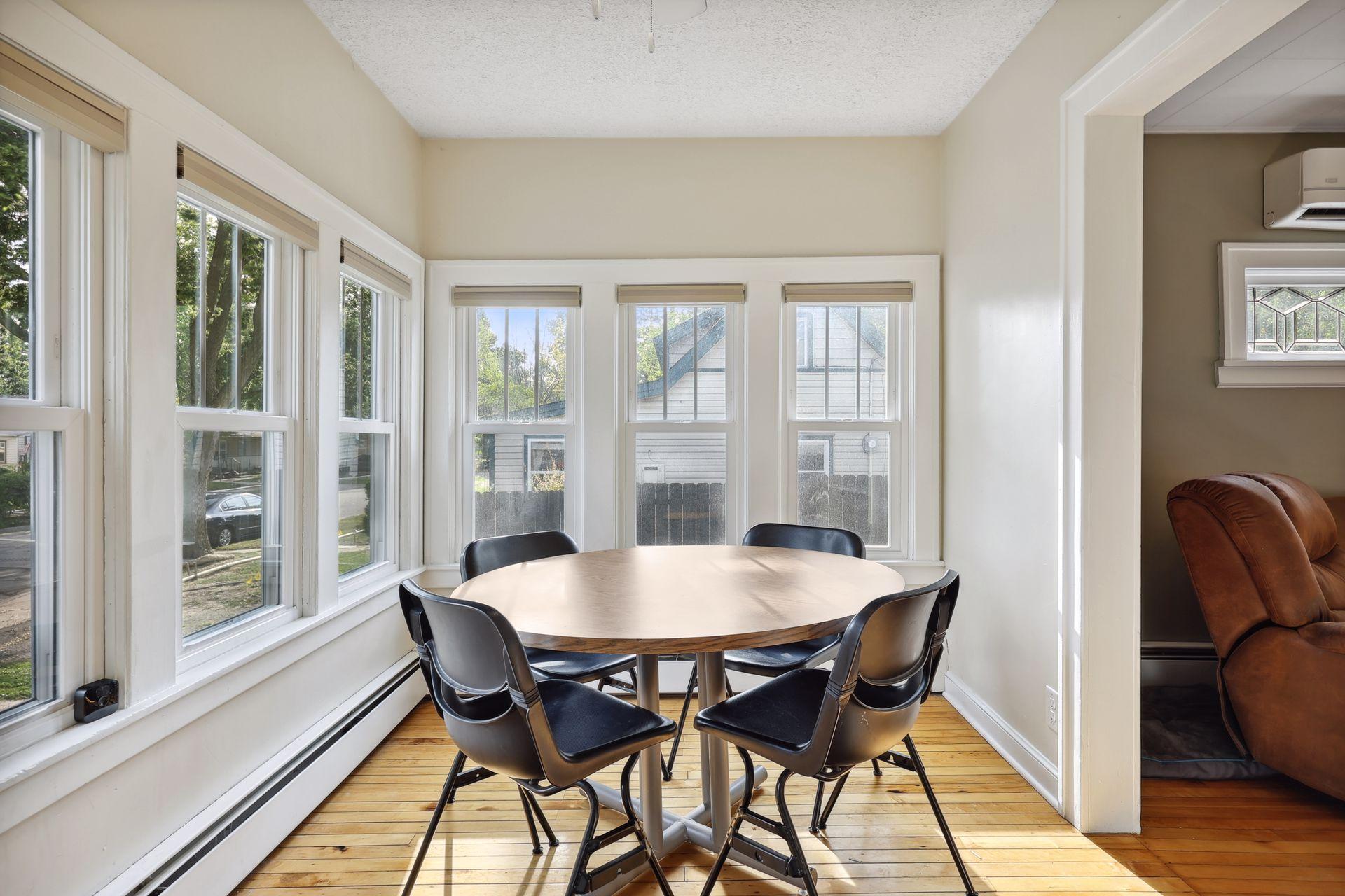 Welcoming front entry with an abundance of windows.