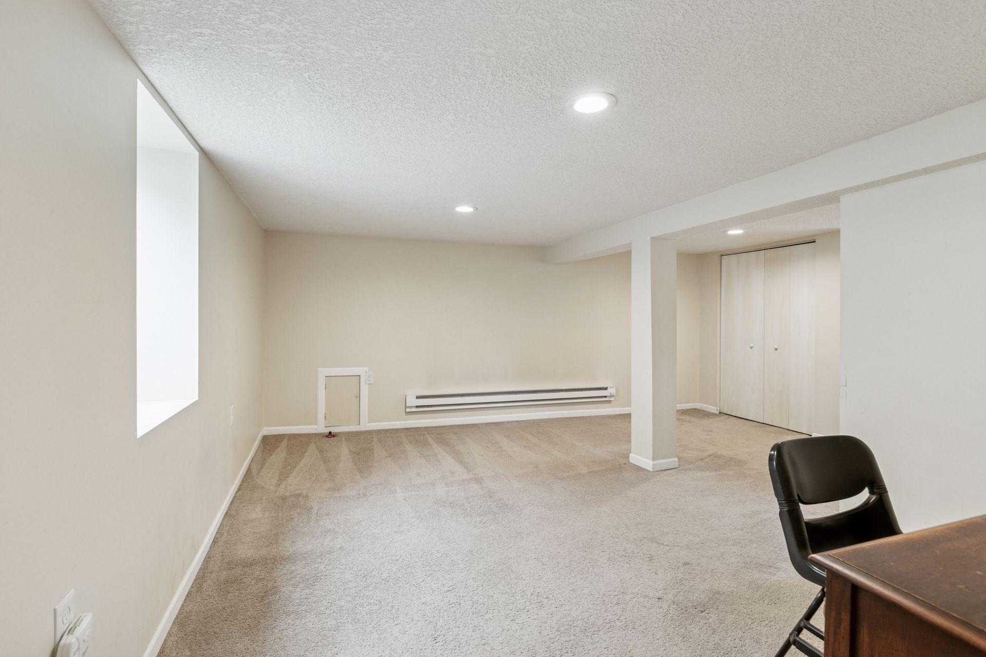 Cozy, finished lower level with egress window.
