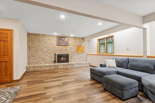 â¢ Lower-Level Living â Huge family room with wood-burning fireplace.
