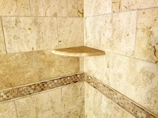 Custom travertine tile shower.