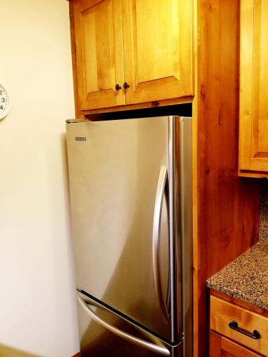 Stainless refrigerator with ice maker.