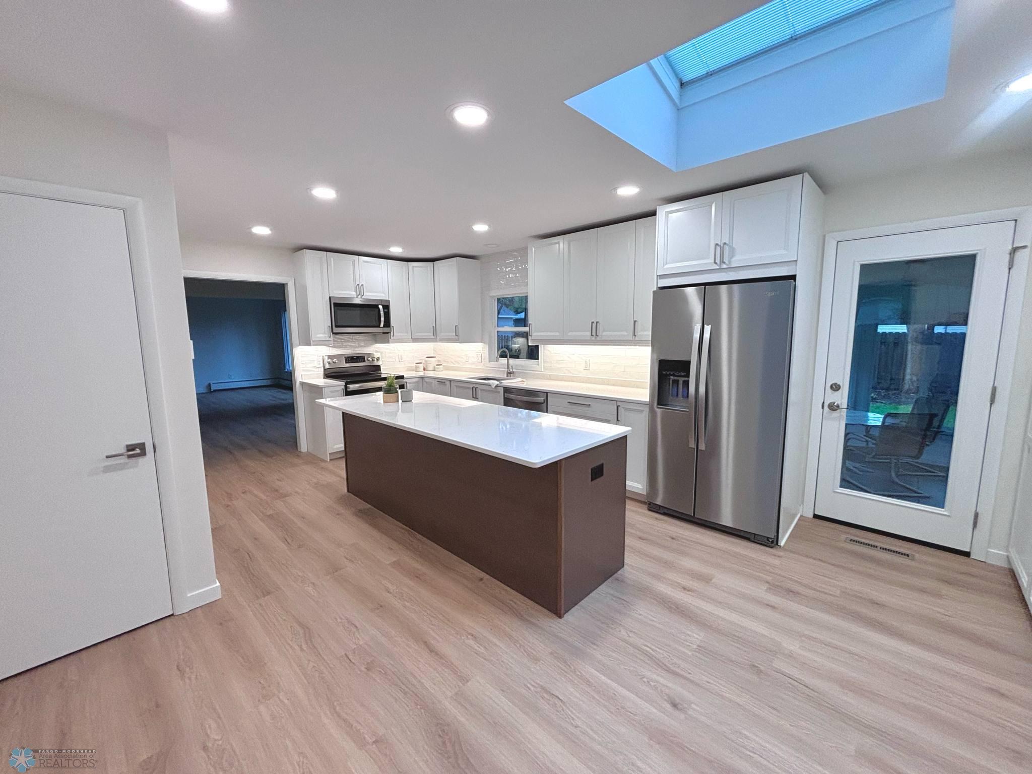 Kitchen - With Skylight & Sunroom Door.jpg