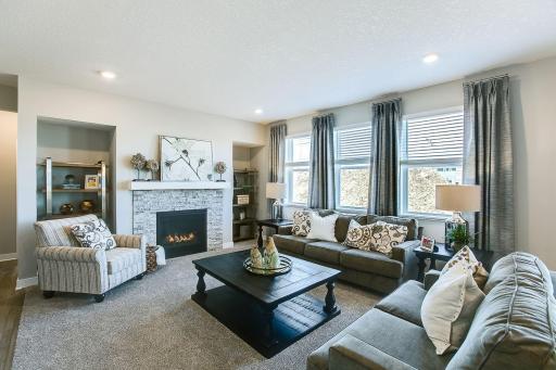 Gas fireplace with surround. *Photos of a similar home. Colors and options may vary.