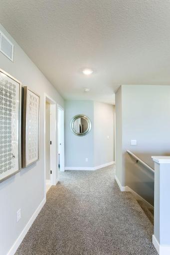 Open area at top of stairs for other 3 bedrooms. *Photos of a similar home. Colors and options may vary.