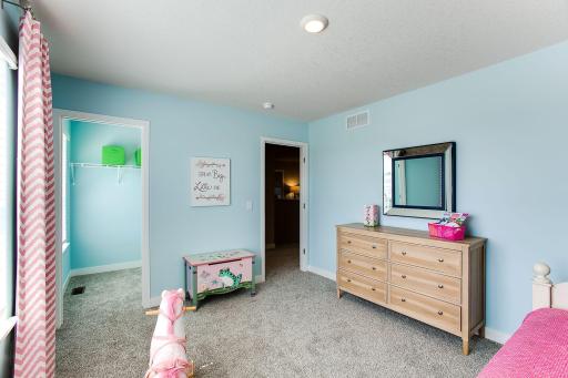 Secondary bedrooms all have walk in closets. *Photos of a similar home. Colors and options may vary.