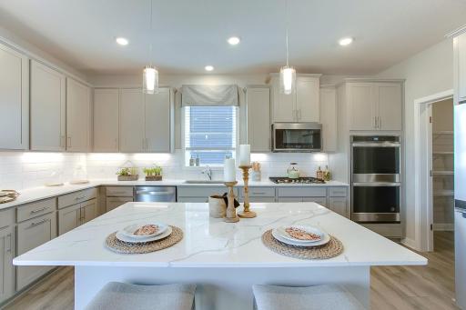 Stunning signature kitchen! *Photos of a similar home. Colors and options may vary.