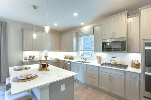 Stunning signature kitchen! *Photos of a similar home. Colors and options may vary.