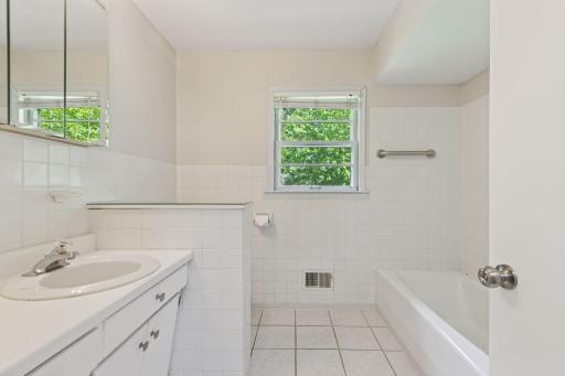 Large main floor full bath with grab bars.