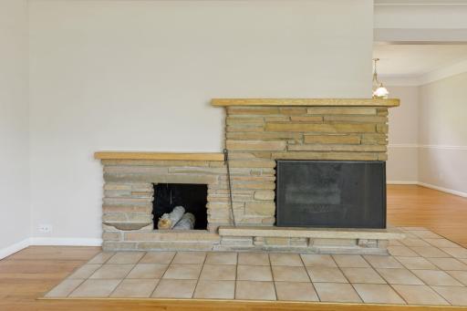 Two sided fireplace with wood storage area