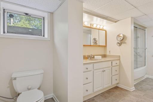 Lower level full bathroom with tub and shower