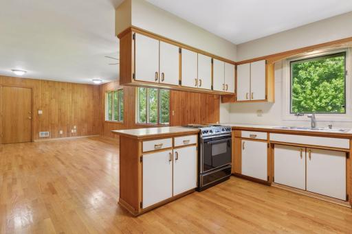 Good space in the kitchen. two pantry doors and a newer refrigerator.
