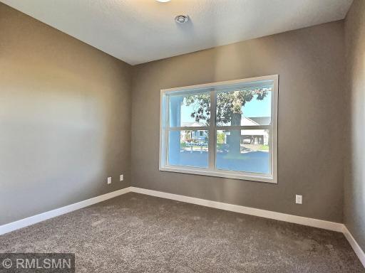 The first bedroom is located at the front of the home, overlooking the front porch and yardâmaking it an ideal space for a home office.