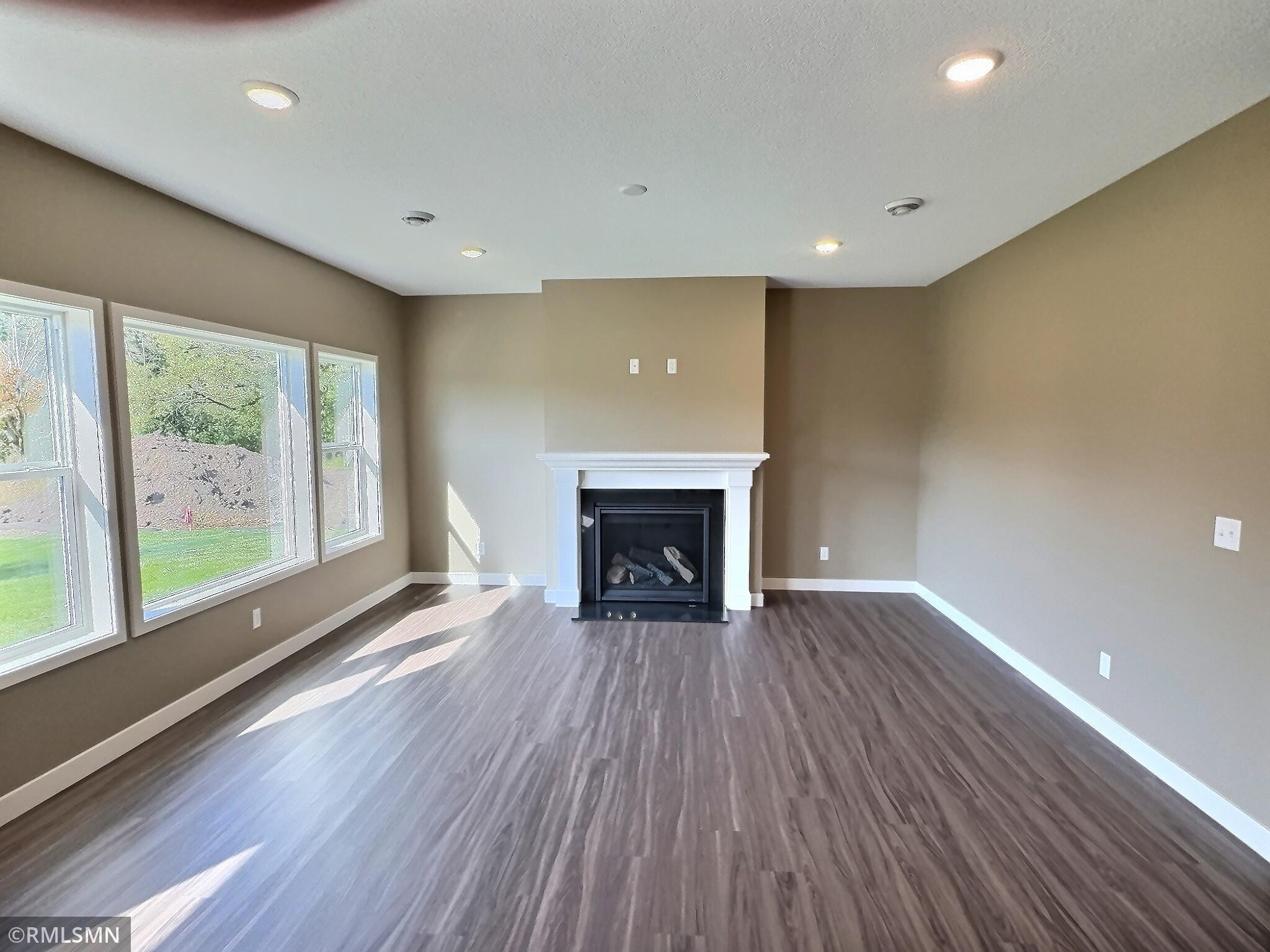 The living room will be centered with a gas fireplace. The living, dining and kitchen area flows seamlessly with one another for great connection to communicate with everyone when entertaining.