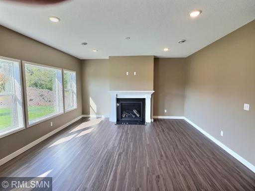 The living room will be centered with a gas fireplace. The living, dining and kitchen area flows seamlessly with one another for great connection to communicate with everyone when entertaining.