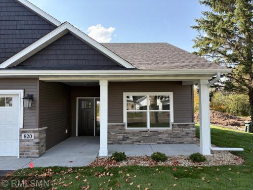 The covered front porch is ideal for relaxing and watching the activity of the neighborhood or just saying hello to those who pass by.