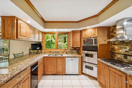 Kitchen-With Wall Oven and Window Above Sink For Outdoor Viewing