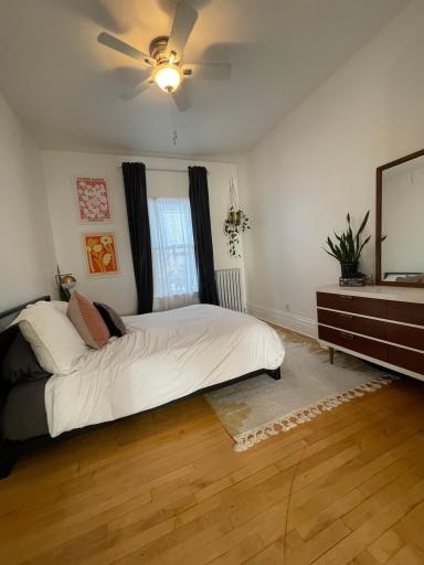 Main level bedroom #1 with previous tenants furniture