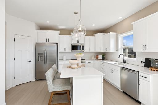 Photo for 4920 Noble Lane NW, Rochester, MN 55901 - listing #6725527 (Photos of model home, finishes will vary) The spacious kitchen features brand-new stainless steel appliances, a center island and ample cabinetry storage.